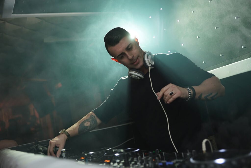 DJ mixing electronic music at a club night